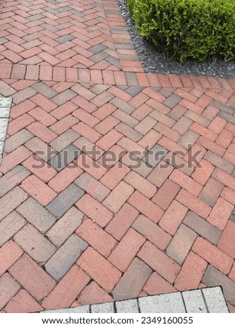 Interlocking multicolor brick sidewalk in city