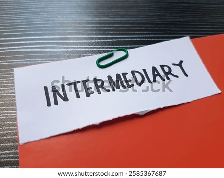 Intermediary writting on table background.