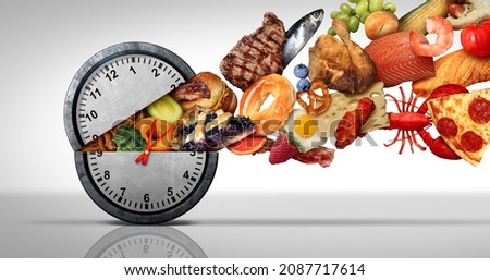 Intermittent fasting concept and calorie restriction or autophagy diet symbol nutrition concept and binge eating disorder with an open clock icon releasing food.