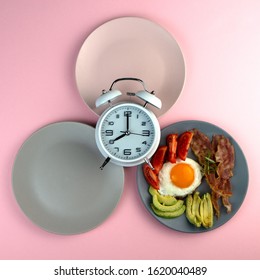 Intermittent fasting concept with empty colorful plates. Time to lose weight , eating control or time to diet concept. - Shutterstock ID 1620040489