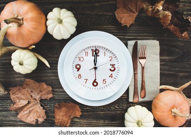 Intermittent Fasting Concept With Holiday Place Setting With Plate, Napkin, Antlers And Silverware On A Thanksgiving Day Decorated Table Shot From Flat Lay Or Top View Position. 