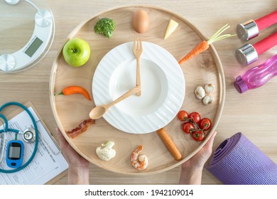 Intermittent Fasting IF Diet Concept With 16:8 Hour Clock Timer For Skipping Meal And Eating Keto Low Carb, High Fat Food Meal Healthy Nutritional Dish With Gym Exercise For Body Weight Loss