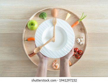 Intermittent Fasting IF Diet Concept With 8-hour Clock Timer For Eating Nutritional Or Keto Low Carb, High Fat And Protien Food Meal Healthy Dish And 16-hour Skipping Meal For Weight Loss