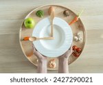 Intermittent fasting IF diet concept with hour clock timer for eating nutritional or ketogenic food and keto low carb, high fat and protien food meal healthy dish and skipping meal for weight loss