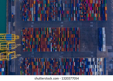 A Lot Of Intermodal Shipping Container Are In A Port. Cargo Transportation System On Ships. Graphic View Of Multi-colored Containers On Top. Aerial Photo