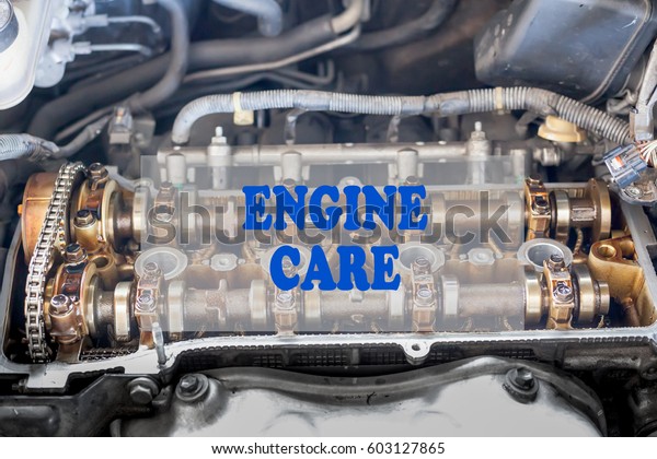 internal car engine  background.\
Automobile service Maintenance  concept with title ENGINE\
CARE