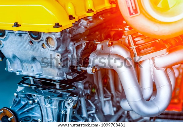 Internal combustion engine automotive, engine\
fragment close-up.