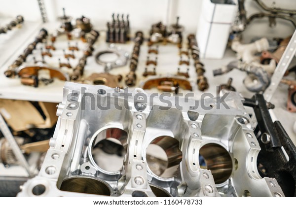The internal combustion engine, disassembled,
repair at car service, overhaul. Repair at car service station.
Neatly laid out on the
table