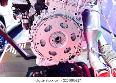 An Internal Combustion Engine Flywheel Assembly On A Store Display Case.