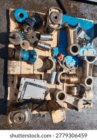 Internal components of a triplex pump during full maintenance disassembly, revealing plungers, pistons, and precision mechanical parts that operate behind high pressure pumping systems.
