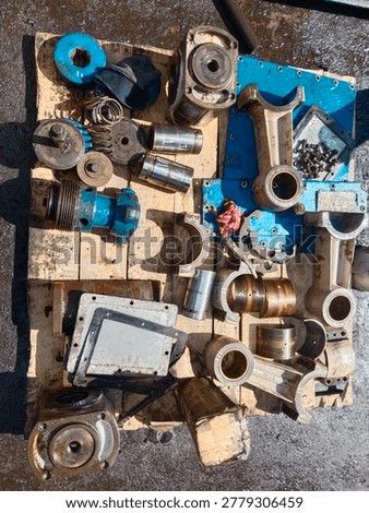 Internal components of a triplex pump during full maintenance disassembly, revealing plungers, pistons, and precision mechanical parts that operate behind high pressure pumping systems.