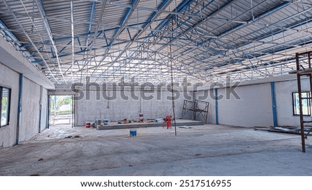 internal construction site. Ceiling installation with expert technicians In the room that is in the construction process.