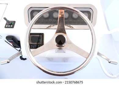 Internal Control Cabin Of A Motor Yacht. Control Panel, Steering Wheel, Marine Radio And Shift Levers.