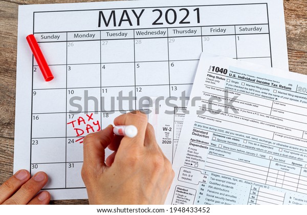 Internal\
Revenue Service (IRS) has extended the deadline for filing US\
federal income tax until May 17 2021. Concept image showing a\
calendar page marking the new tax day for\
2021.