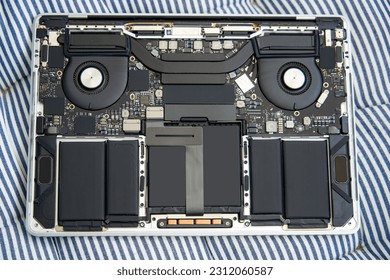 The internal structural electronic components of a disassembled high-end laptop