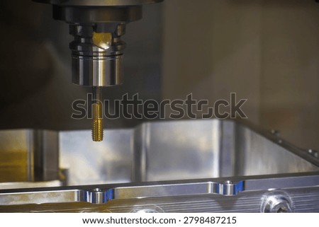 The  internal threading and tapping process on aluminum case parts or enclosure housings using a CNC milling machine.
