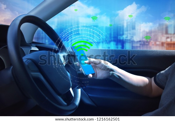 Internal view and automatic self\
command driving  with smartphone , Electric smart car\
technology.