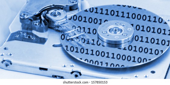 Internals of a computer harddrive with binary number reflections with blue colors (HDD, winchester)