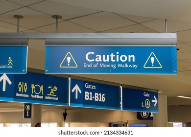International Airport Sign Caution End Of Moving Walkway In Interior Air Terminal