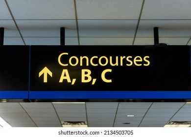International Airport Sign Concourses A B C in interior air terminal - Shutterstock ID 2134503705