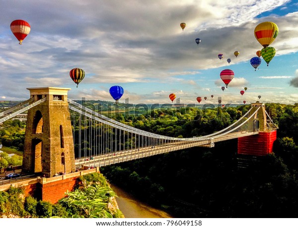 The\
international balloon fiesta is an annual event in Bristol. This\
photo captures the afternoon flight as the balloons come over the\
Clifton Suspension Bridge. Photo taken in\
2012.