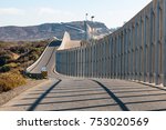 The international border wall between San Diego, California and Tijuana, Mexico, as it begins its journey from the Pacific coast and travels over nearby hills.  