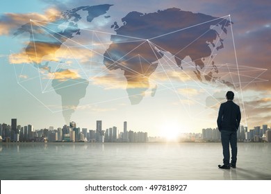 International business concept with businessman on city skyline background with network on map and sunlight - Shutterstock ID 497818927