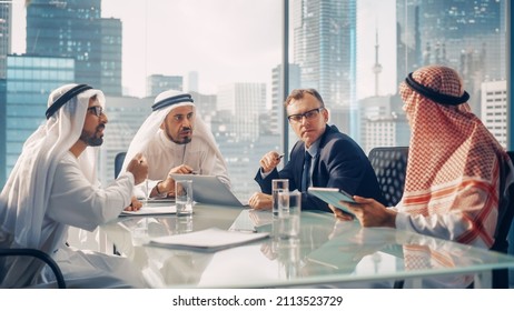 International Business Consultant Advices On Diversification Of Investment Portfolio To Successful Arab Company Owners. Multicultural Meeting In Modern Office Between American And Emirati Businessman