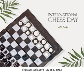 International Chess Day Card. Chess Game. Holiday Card With Chess Board With Placed Pieces And Palm Leaves On A Blue Background With Inscription International Chess Day, 20 July