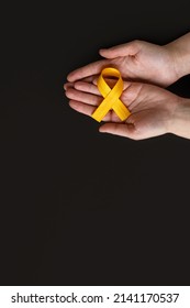 International Childhood Cancer Day. Adult Holding Yellow Ribbon. Sarcoma Awareness, Bladder Cancer. Leukemia Cancer Awareness. World Multiple Sclerosis Day. I Am And I Will. Copy Space. Vertically