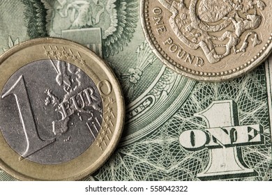 International Currencies Including Euro, Pound Sterling One Pound Coin And Dollar Bill