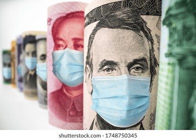 International Currency Money Include US American Dollar, Euro Currency, British UK Pound, Australian Dollar, China Yuan And Japan Yen Face Mask Concept Of Coronavirus Disease COVID-19 Economic Crisis.