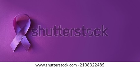 International Epilepsy Day. Purple ribbon on purple background. Alzheimer's disease, Pancreatic cancer, Hodgkin's Lymphoma awareness. World Lupus Day and world cancer. Banner. copyspace