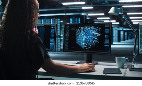 International Female Computer Scientist Develop Neural Network at her Workstation. Display Shows Graphic Projection of Neural Network, Artificial Intelligence Simulation