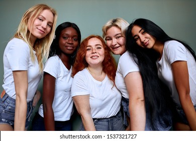 International group of young smiling girls together, youth. Various apperances, races, nations