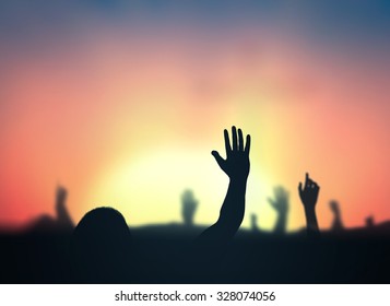 International Human Rights Day Concept: Silhouette People Hands Rising Over Blurred Abstract Autumn Sunset Background