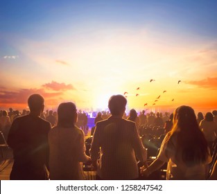 International Human Solidarity Day concept: Blurred Christian Congregation Worship God together in Church hall in front of music stage and light effected	