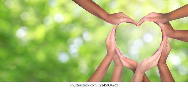 International Human Solidarity Day concept: Unity and diversity are at the heart of a diverse group of people connected together as a supportive symbol that represents a sense of teamwork. - Shutterstock ID 2145084263