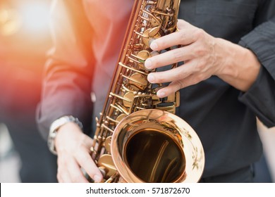 International jazz day and World Jazz festival. Saxophone, music instrument played by saxophonist player musician in fest. - Shutterstock ID 571872670
