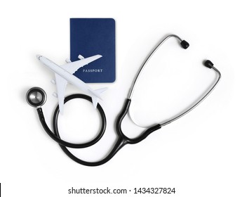 International Medical Travel Insurance Concept, Stethoscope, Passport And Airplane Isolated On White Background