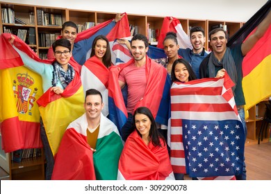International multiethnic exchange of students, happy students presenting their countries with flags - Shutterstock ID 309290078