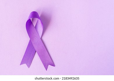 International Overdose Awareness Day. The purple ribbon on the purple background - Shutterstock ID 2183492635