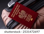 International passport of a citizen of Poland on a suitcase, departure from the airport, international travel