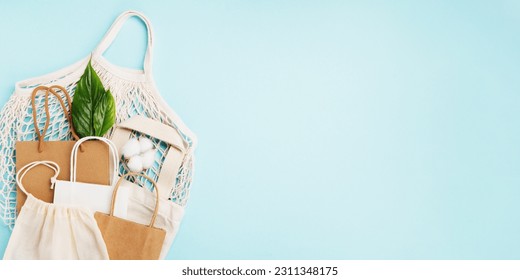 International plastic bag free day concept. Sustainable and Ecology lifestyle. Say no to plastic. Go green. Save nature. Reusable and recycling paper, textile cotton bags, mesh bags on blue background - Shutterstock ID 2311348175