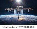 International space station in 2021 in space on orbit of Earth planet. Soyuz spacecraft on ISS. View on surface of planet. Elements of this image furnished by NASA
