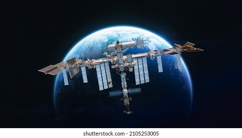 International space station in 2022 on orbit of Earth planet. ISS with astronauts in outer space on orbit. View on surface of planet. Elements of this image furnished by NASA - Powered by Shutterstock