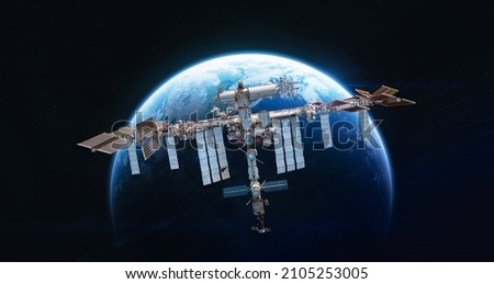 International space station in 2022 on orbit of Earth planet. ISS with astronauts in outer space on orbit. View on surface of planet. Elements of this image furnished by NASA