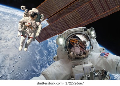 International Space Station And Astronaut In Outer Space Over The Planet Earth. Elements Of This Image Furnished By NASA.