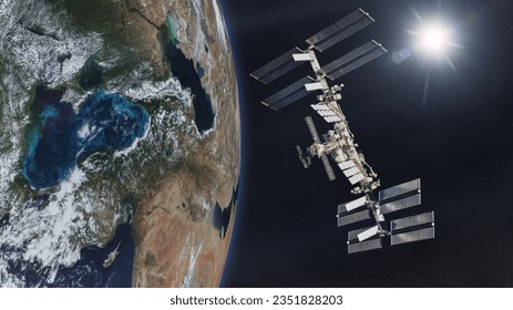 International Space Station on low-orbit of Earth with rising Sun. Elements of this image furnished by NASA.