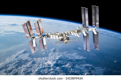 International space station on orbit of Earth planet. ISS. Dark background. Elements of this image furnished by NASA - Shutterstock ID 1453899434